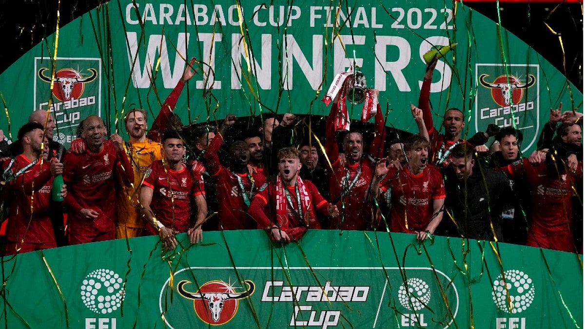 Liverpool players celebrate after winning the English League Cup 2021-22 beating Chelsea in final.