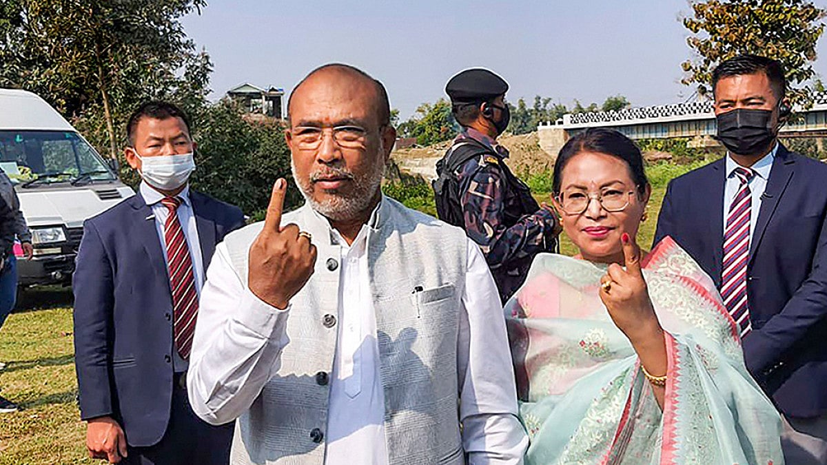 Manipur Chief Minister N. Biren Singh and his wife Hiyainu Devi show their fingers marked