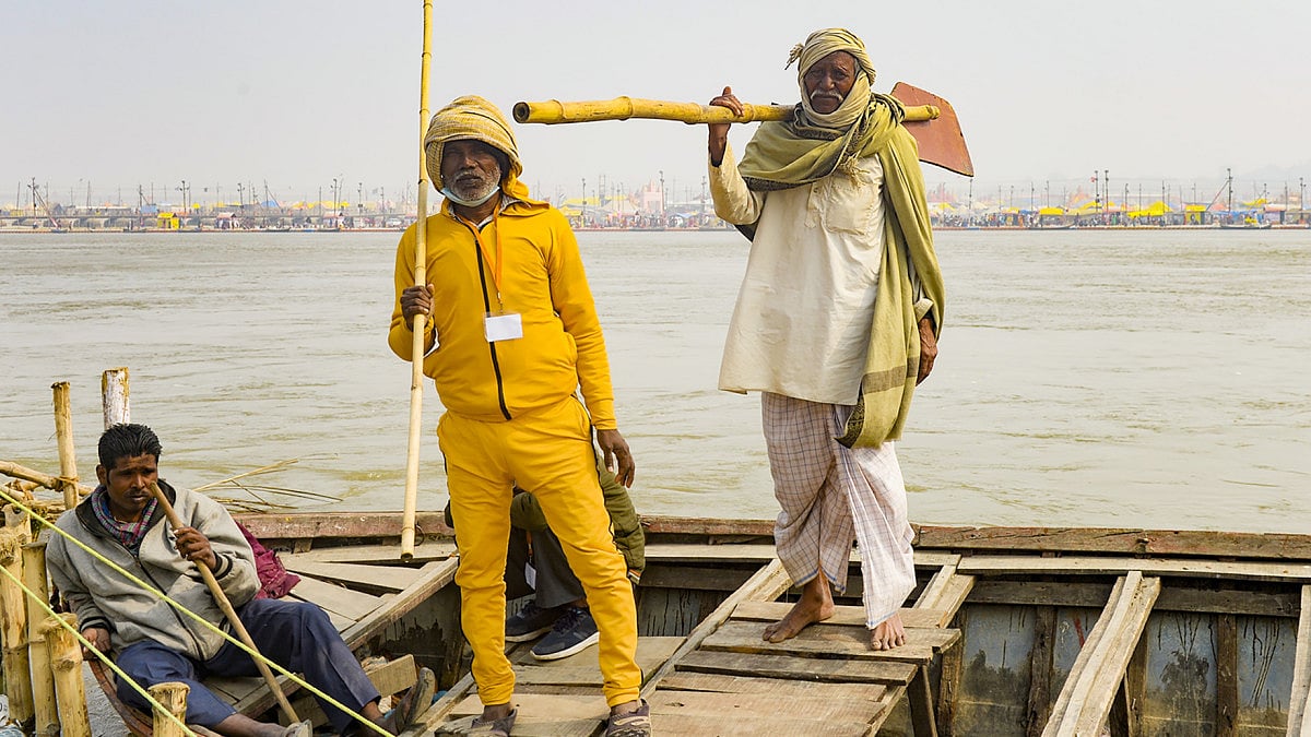 Lallu Dome ( in yellow tracks) with his friends on a boat