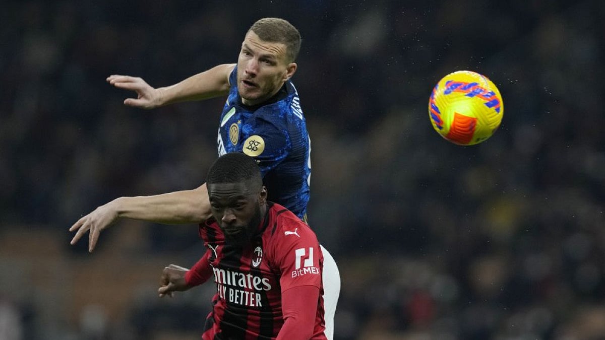 Inter Milan's Edin Dzeko goes for header with AC Milan's Fikayo Tomori in Coppa Italia semifinal.