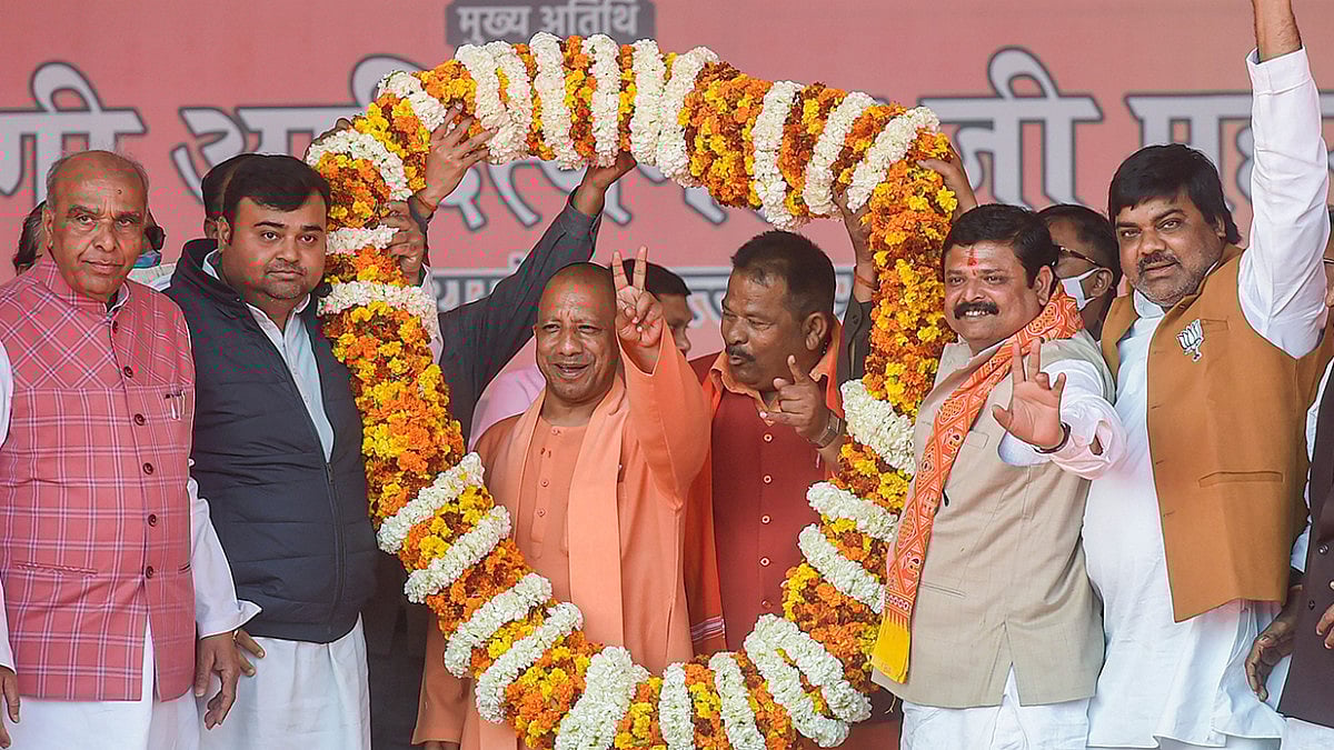 CM Yogi Adityanath shows victory sign at a rally in  Uttar Pradesh.(File photo)