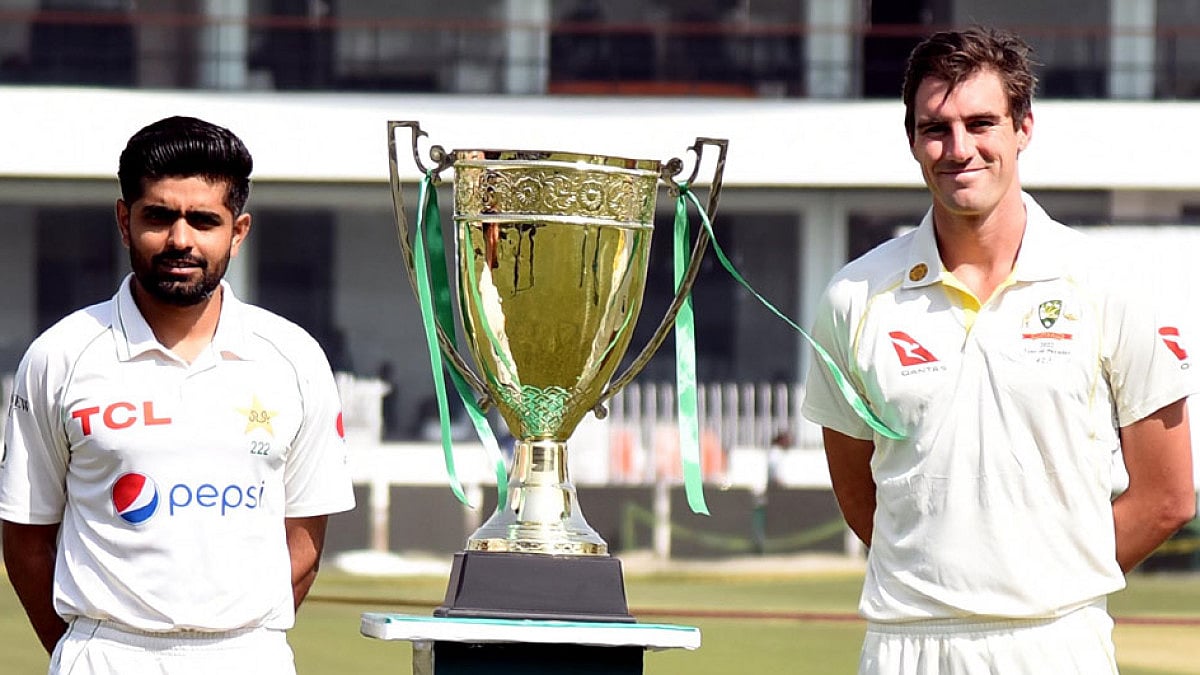 Captains Babar Azam of Pakistan and Pat Cummins of Australia pose with Test series trophy.