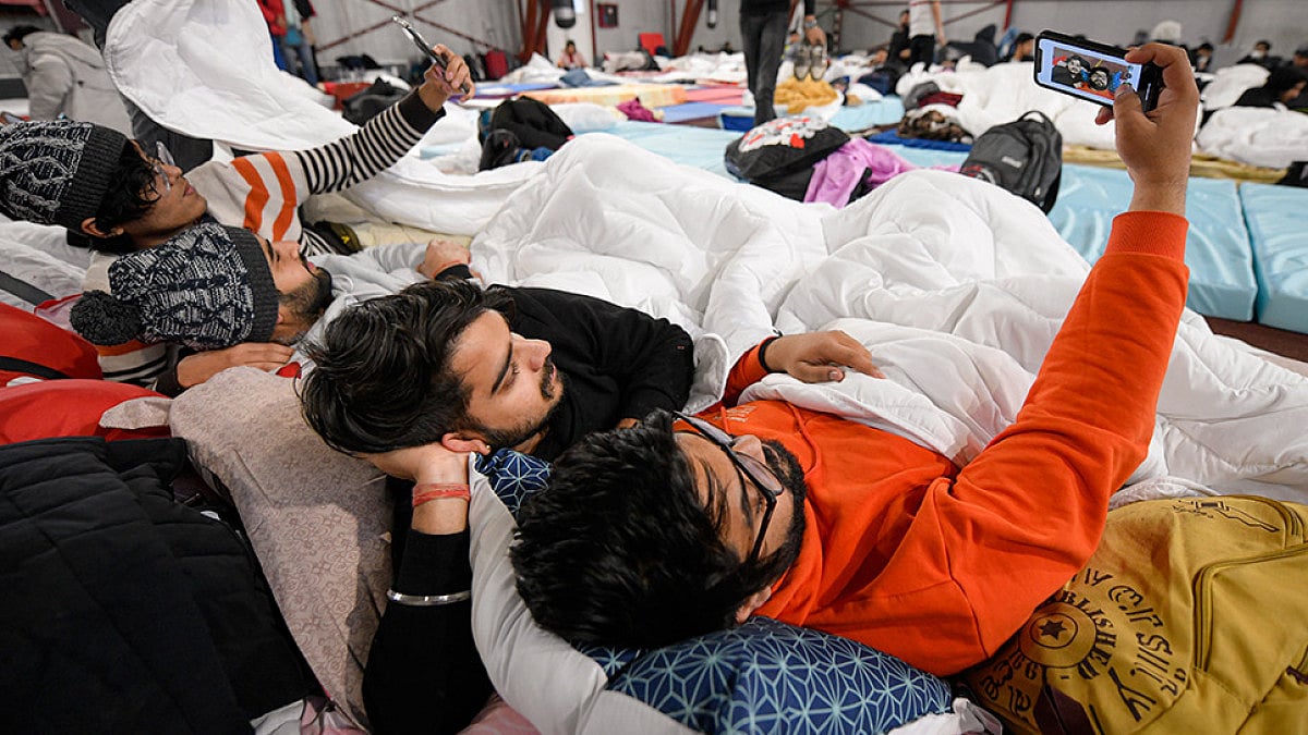 Students from India that fled the conflict from Ukraine take a selfie at a refugee camp in Romania.