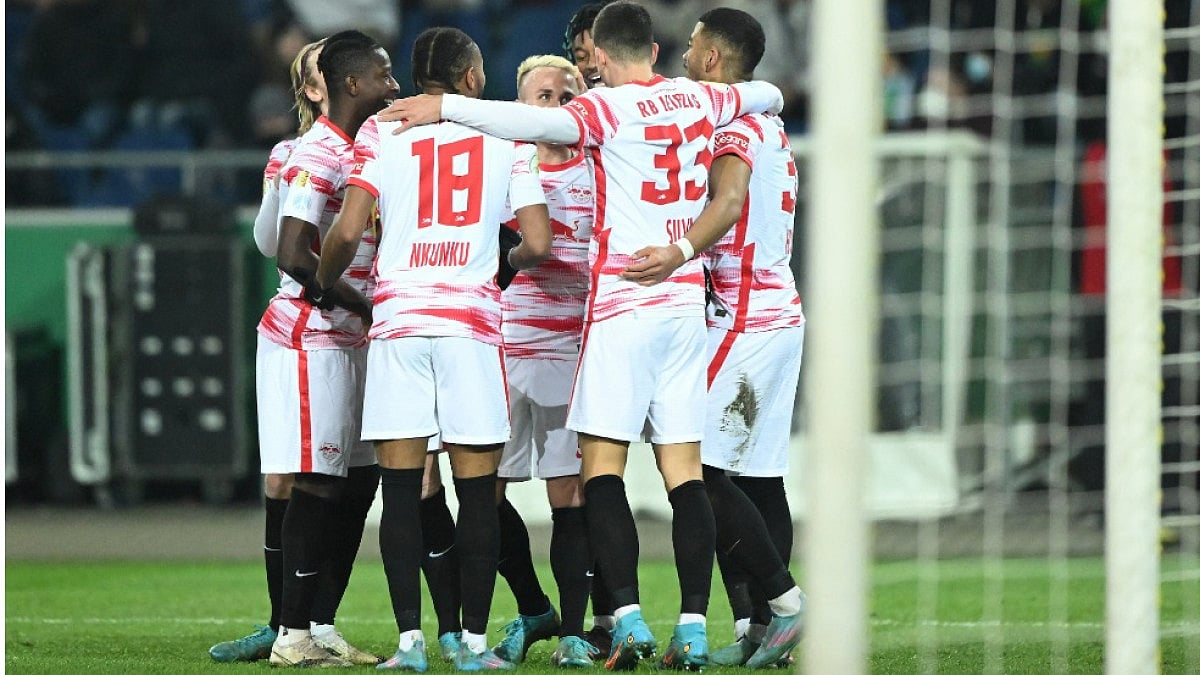 Leipzig players celebrate after their win against Hannover in  German Cup 2021-22.  