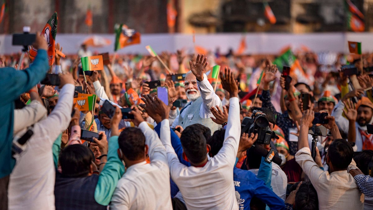 Prime Minister Narendra Modi waves towards supporters, In varanasy, sunday, Feb.27, 2022 