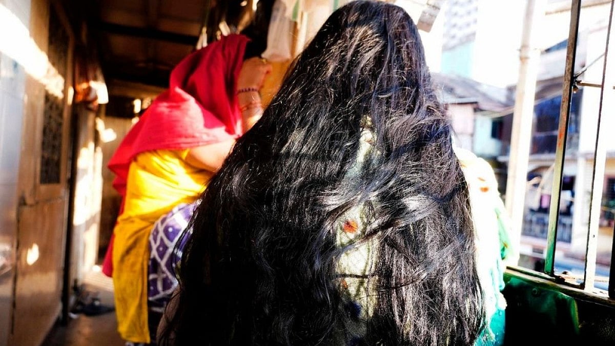 Sex workers sitting in the balcony at Kamathipura in Mumbai