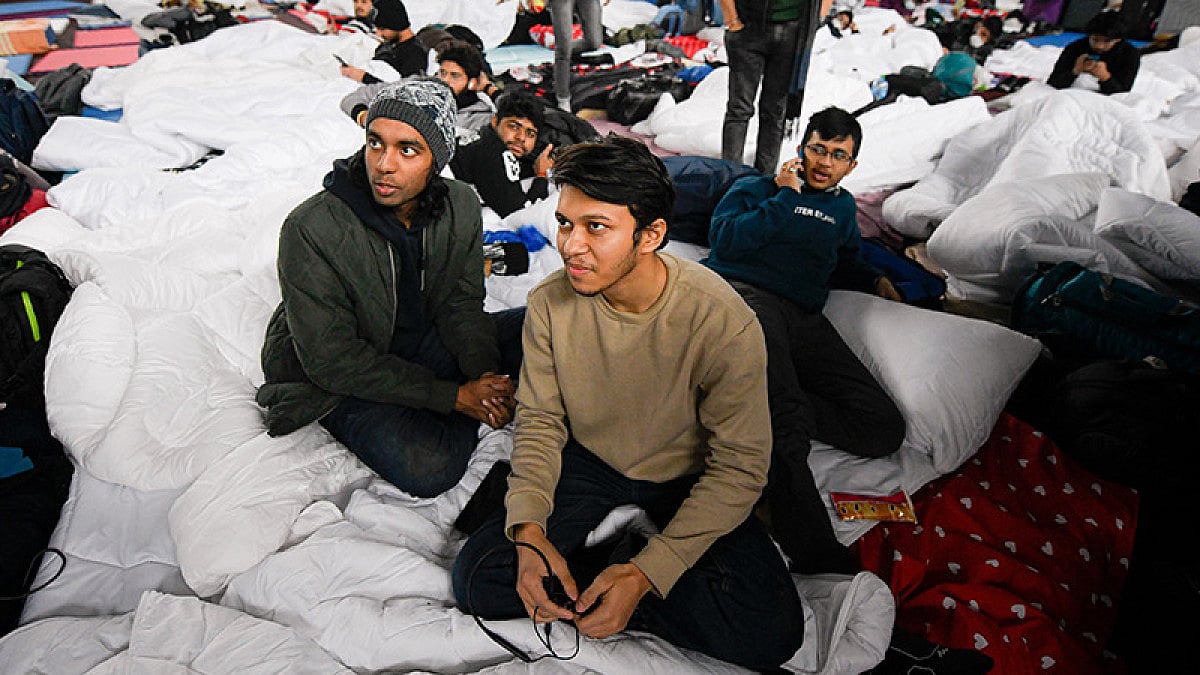 Kevin Francis (left) and Abhijit Singh Negi (right) both studying Medicine in Ukraine, sit in a refu