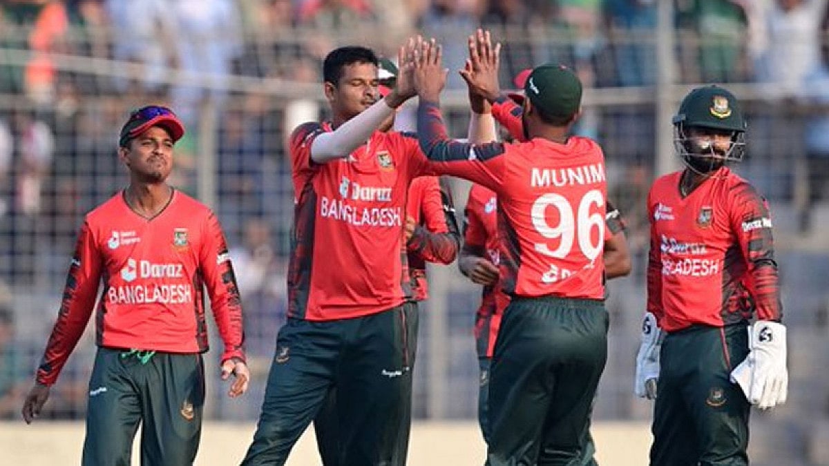 Bangladesh players celebrate the fall of an Afghanistan wicket.