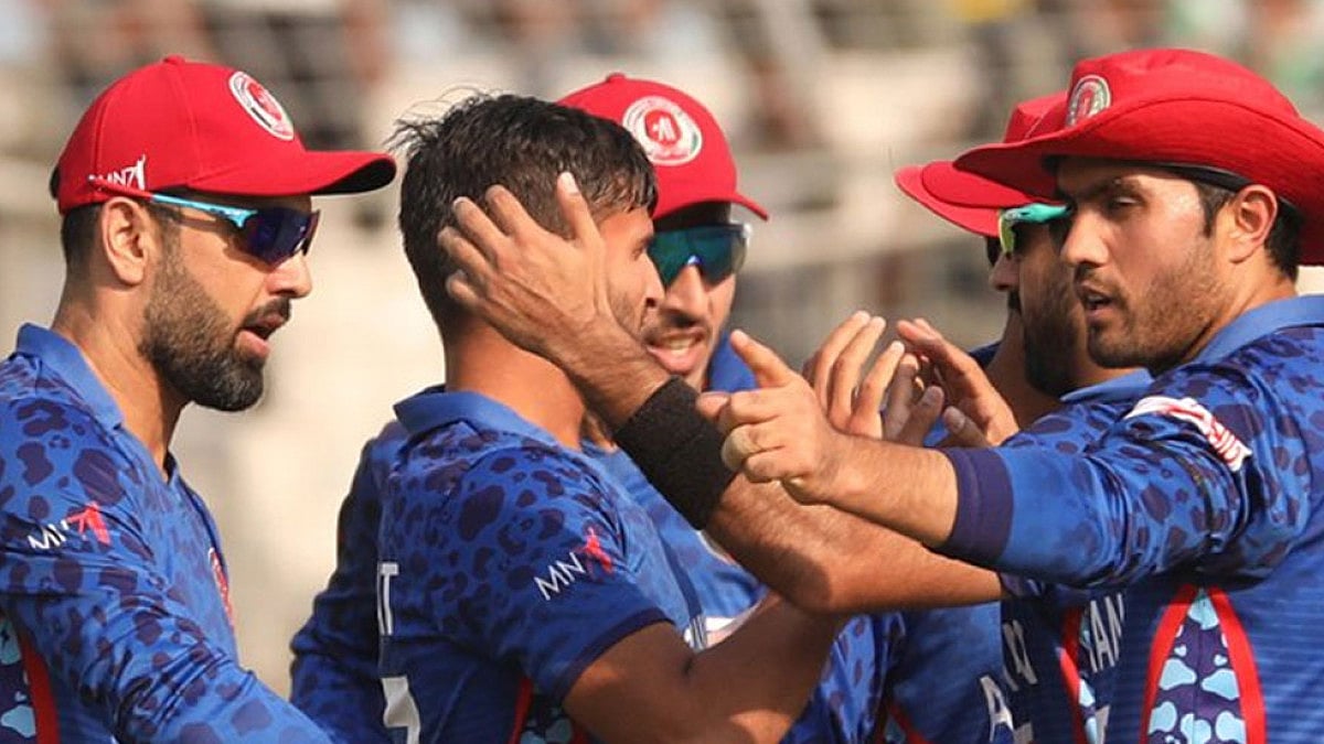Afghanistan players celebrate the fall of a Bangladesh wicket during their second T20I match.