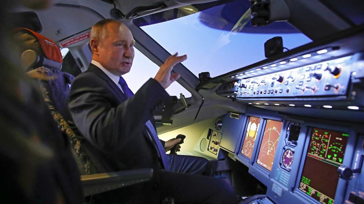  Russian President Vladimir Putin sits in the cockpit of an airplane in Moscow, Russia.