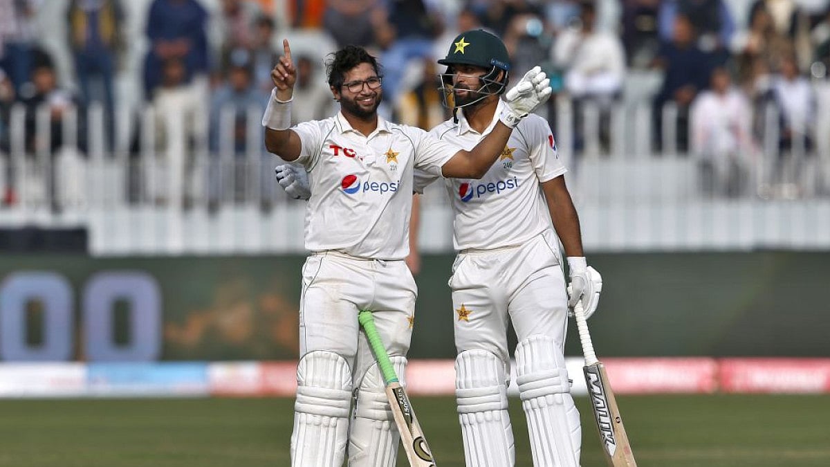 Imam-ul-Haq (L) celebrates after scoring a century on 5th day of Pakistan Vs Australia first Test.