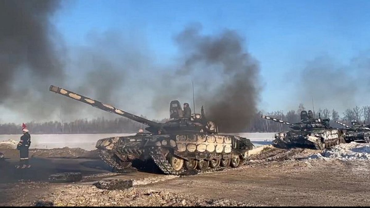 A video grab of Russian army tanks moving back to their permanent base after drills