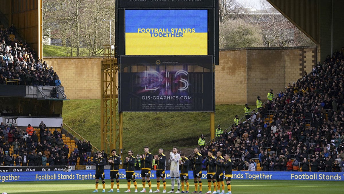 Players from Wolverhampton Wanderers stand for a moment of reflection and solidarity with Ukraine.
