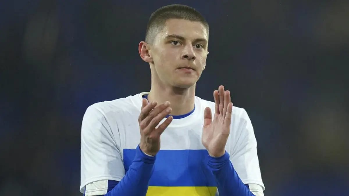 Everton's Vitaliy Mykolenko from Ukraine, wears the Ukrainian flag on his t-shirt in a FA Cup tie.