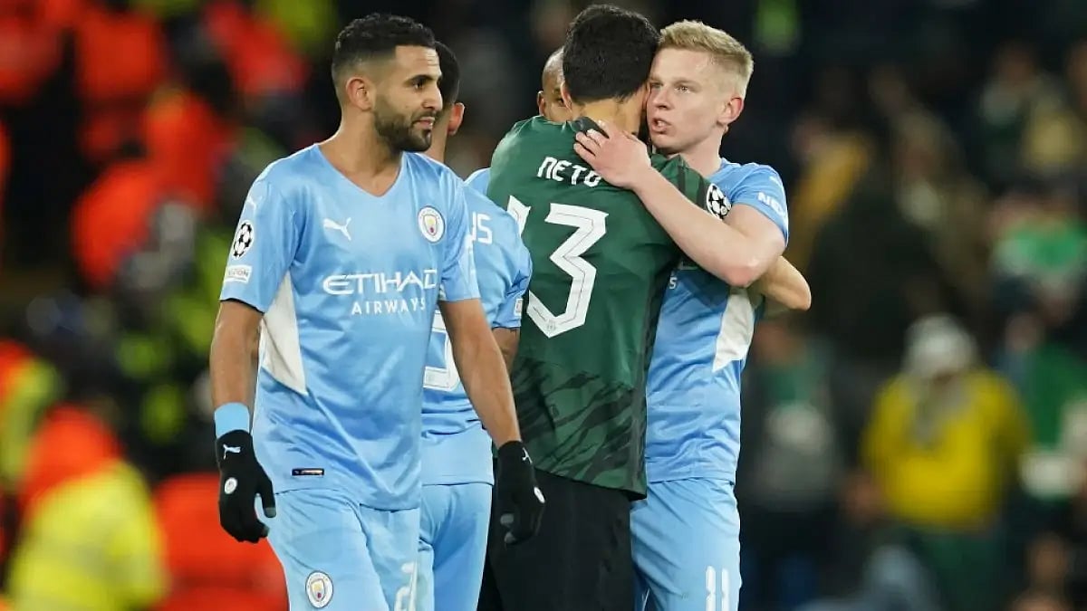Manchester City and Sporting Lisbon players greet each other after their UEFA Champions League tie.