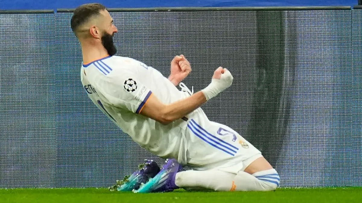 Real Madrid's Karim Benzema celebrates after scoring against PSG in UEFA Champions League 2021-22. 