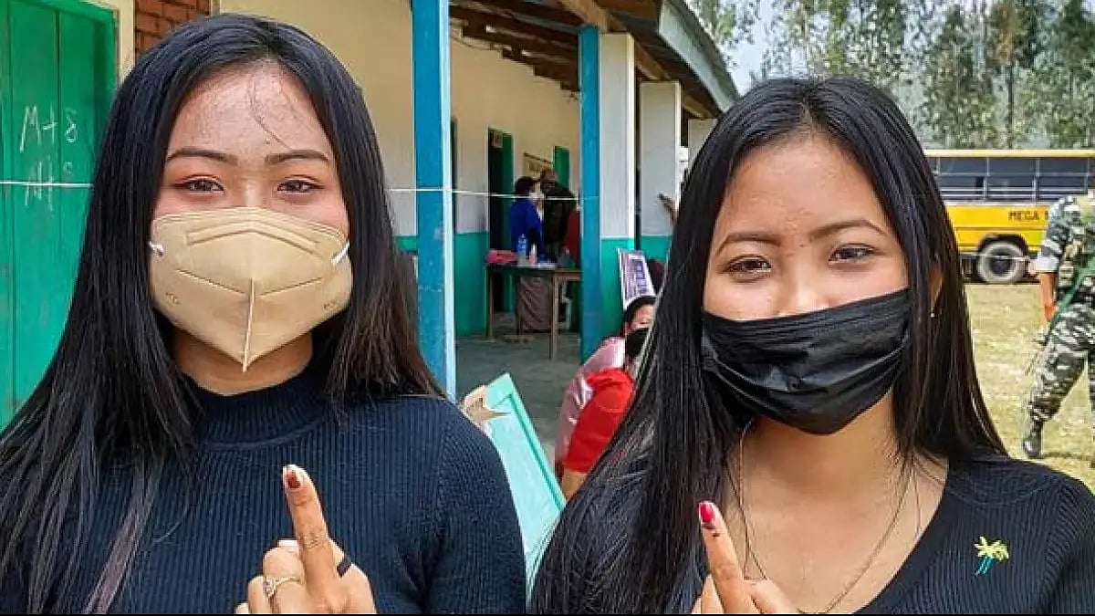 Women in Manipur show their fingers marked with indelible ink after casting votes.