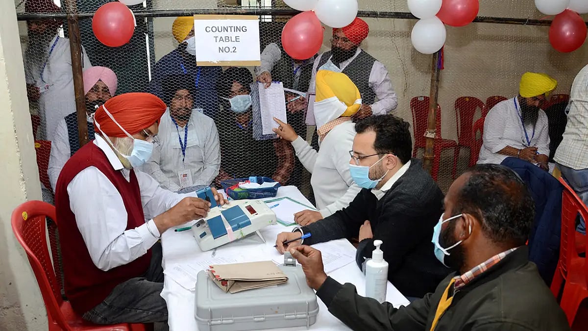 Election staff during counting day of Punjab Assembly elections, at a counting centre in Amritsar di