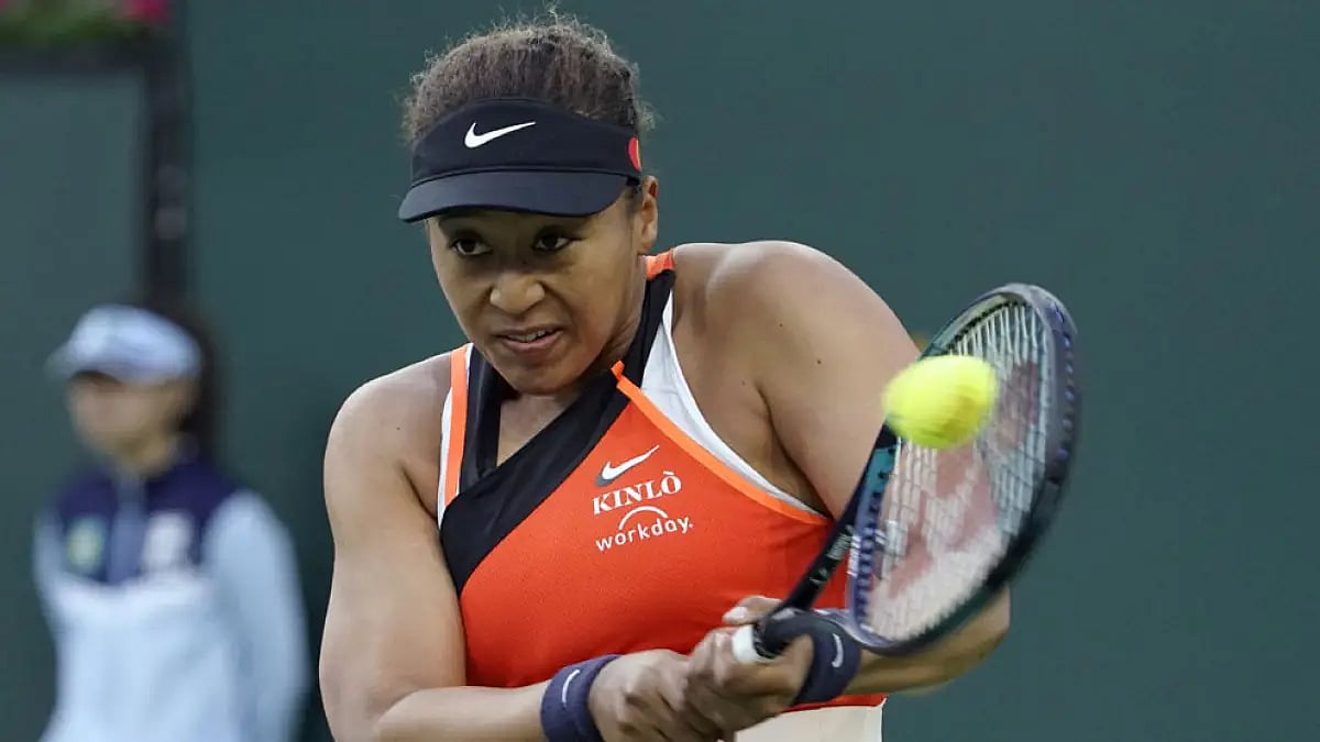 Naomi Osaka returns a shot to Sloane Stephens at the BNP Paribas Open tennis tournament.
