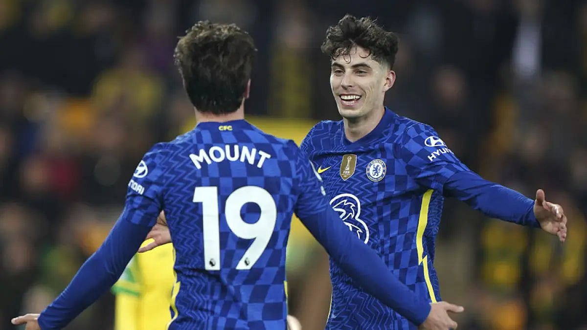 Chelsea players celebrate a goal against Norwich City during their EPL match.