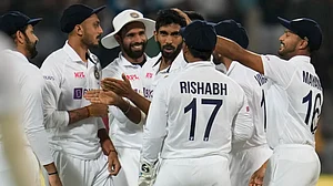 Indian players celebrate the dismissal of Sri Lanka's Lahiru Thirimanne in the second Test.