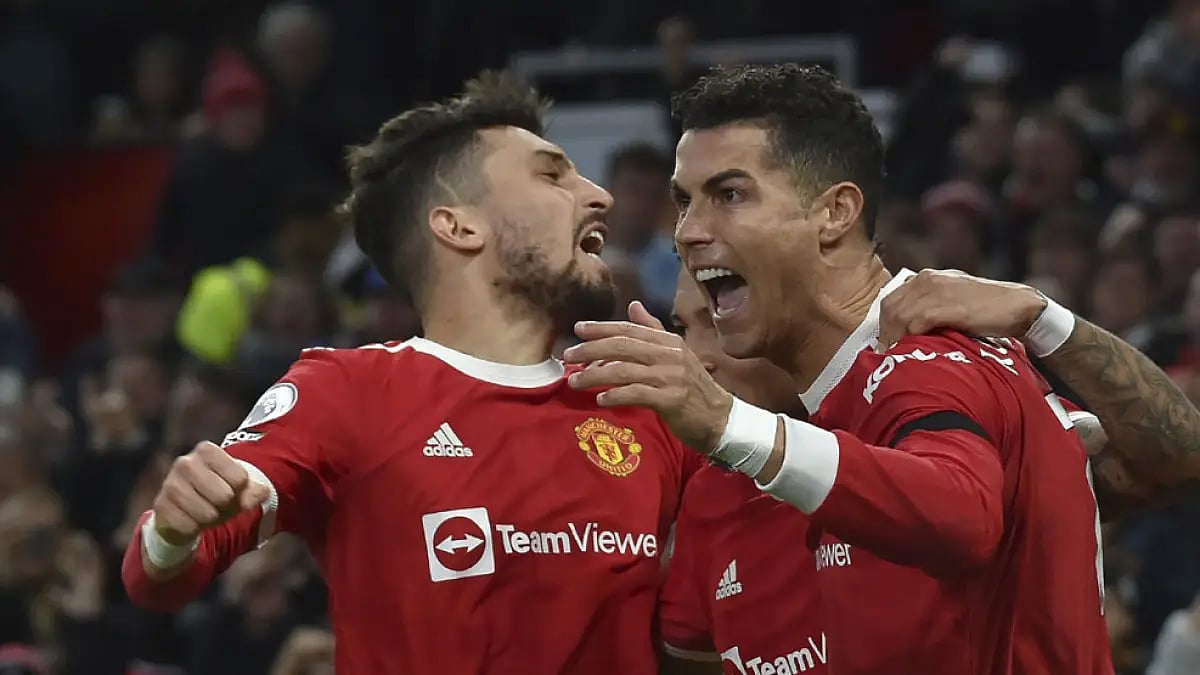 Cristiano Ronaldo, right, celebrates with Manchester United teammates a goal against Tottenham.