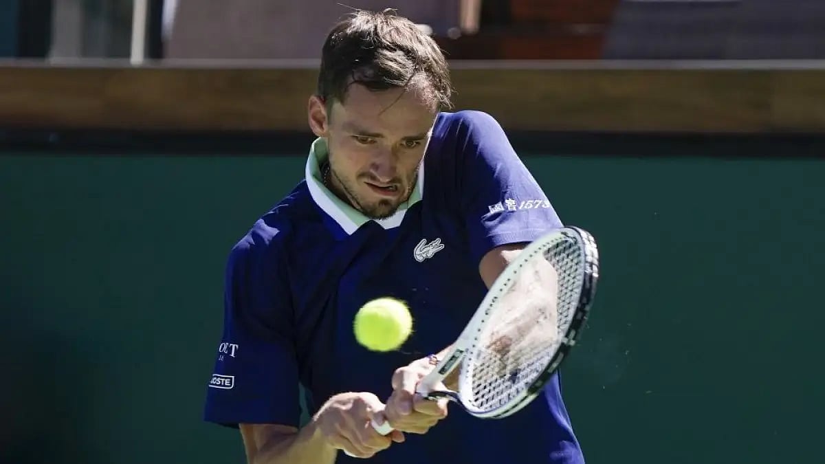 Daniil Medvedev returns a shot to Tomas Machac at Indian Wells 2022 tennis tournament.