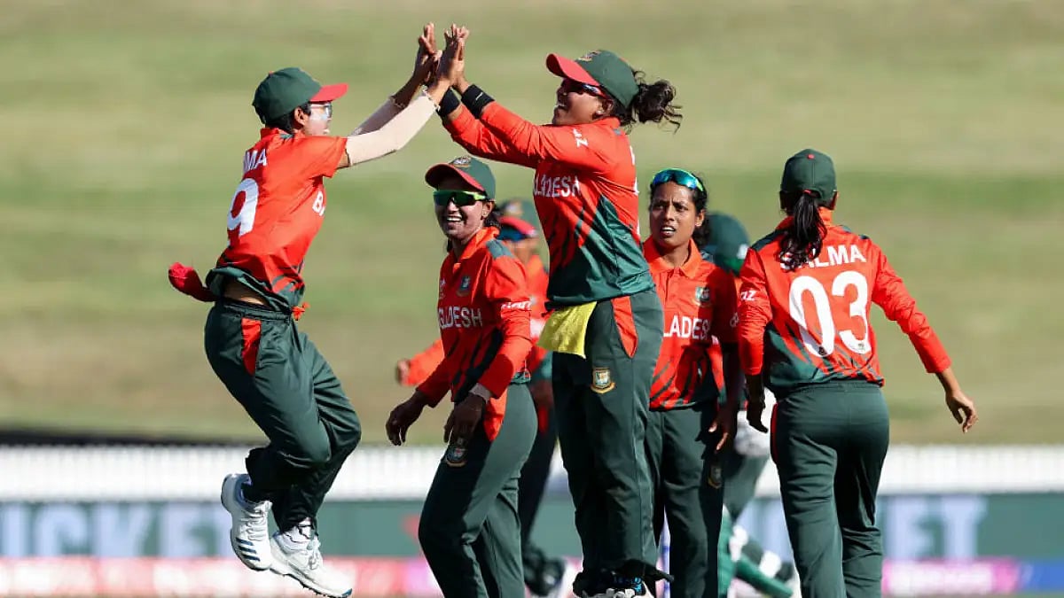 Bangladesh players celebrate the fall of a Pakistani wicket during their Women's World Cup match.