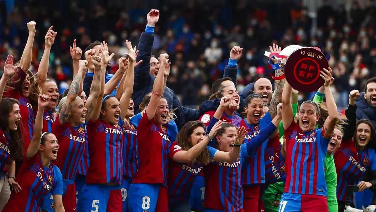 Barcelona players celebrate at the end of Women's La Liga match against Real Madrid.