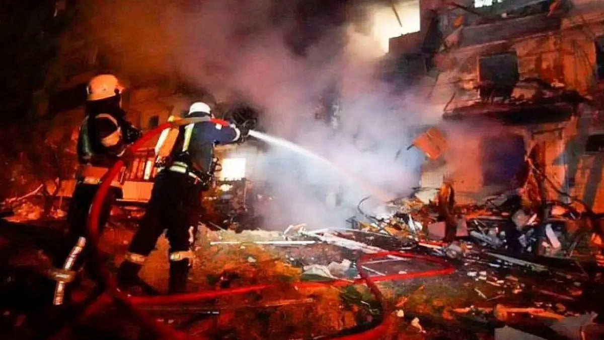 Firefighters dousing the flame at a residential neighbourhood in Kyiv