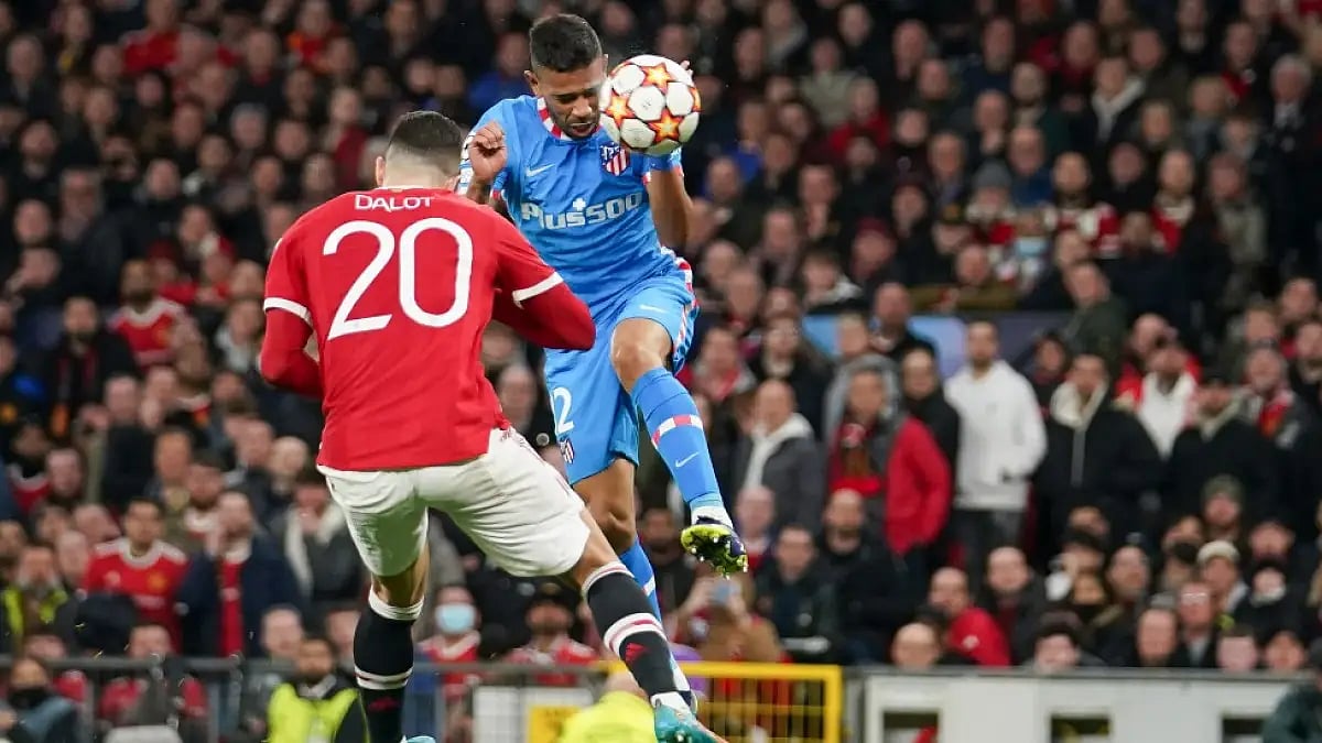 Renan Lodi heads the ball past Diogo Dalot in UEFA Champions League round of 16 tie on Wednesday.
