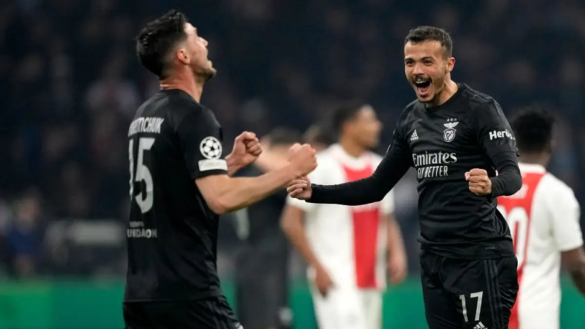 Benfica players celebrate after beating Ajax in UEFA Champions League 2021-22. 