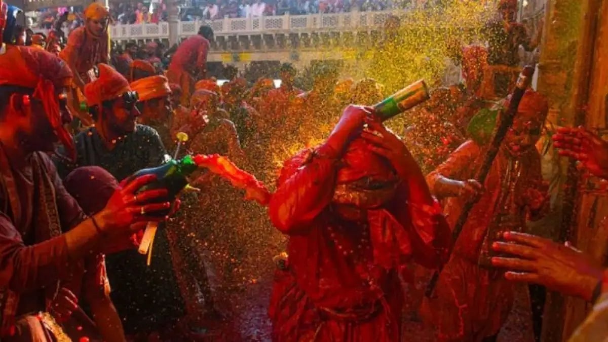 People celebrate Holi at Nandgaon, in Mathura.