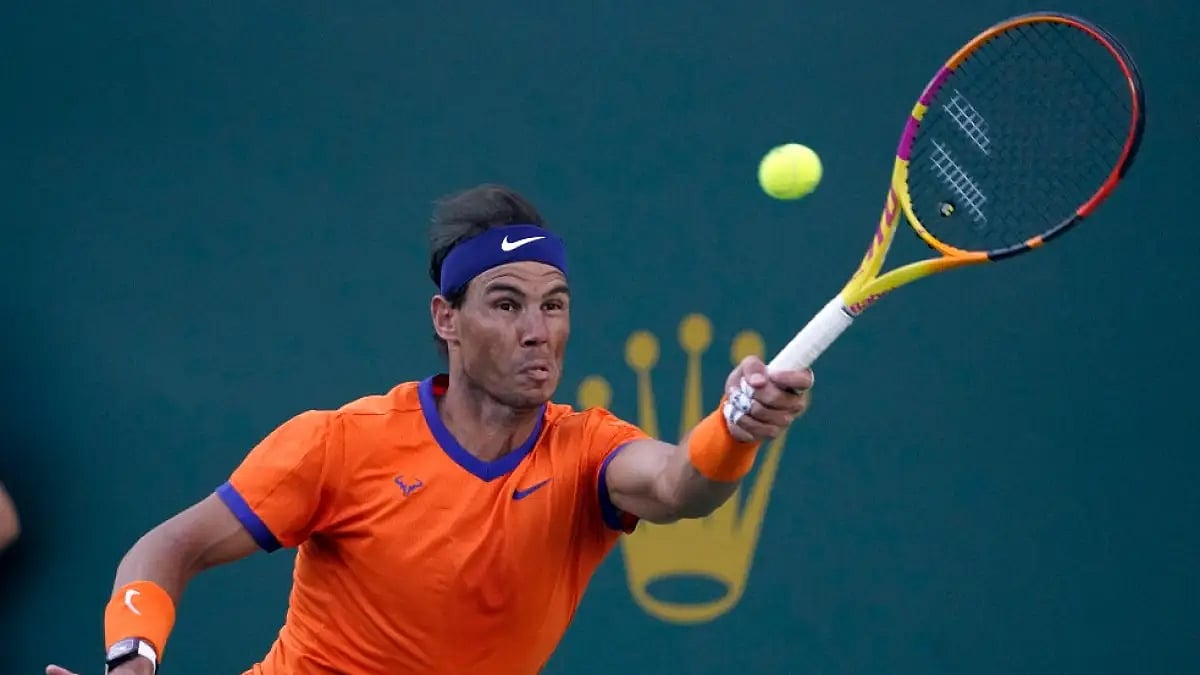 Rafael Nadal returns to Nick Kyrgios during their Indian Wells Masters 2022 quarterfinal match. 