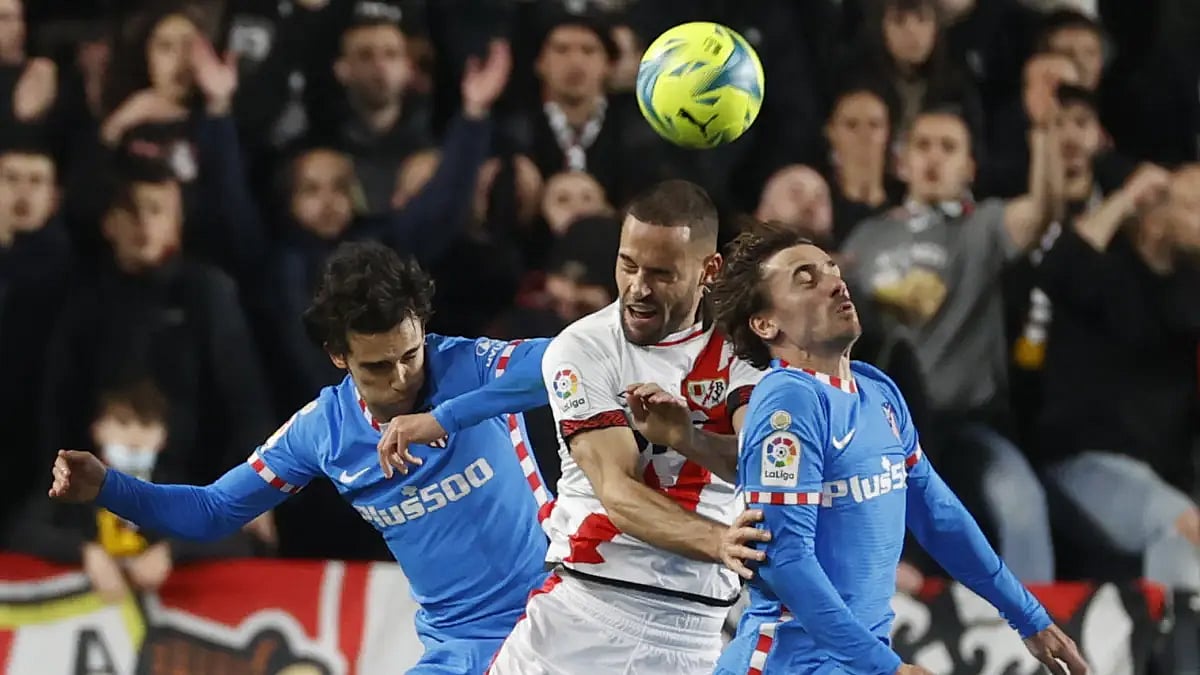 Atletico Madrid and Rayo Vallecano players fight for the ball in La Liga 2021-22 match. 
