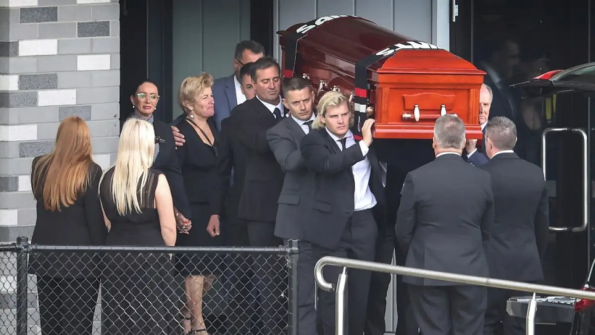 The coffin of Shane Warne is carried by his son Jackson following a funeral service in Melbourne.