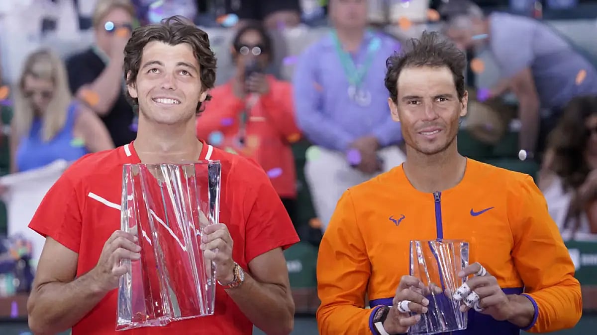 Taylor Fritz, left, and Rafael Nadal, pose with trophies after their Indian Wells Masters final.
