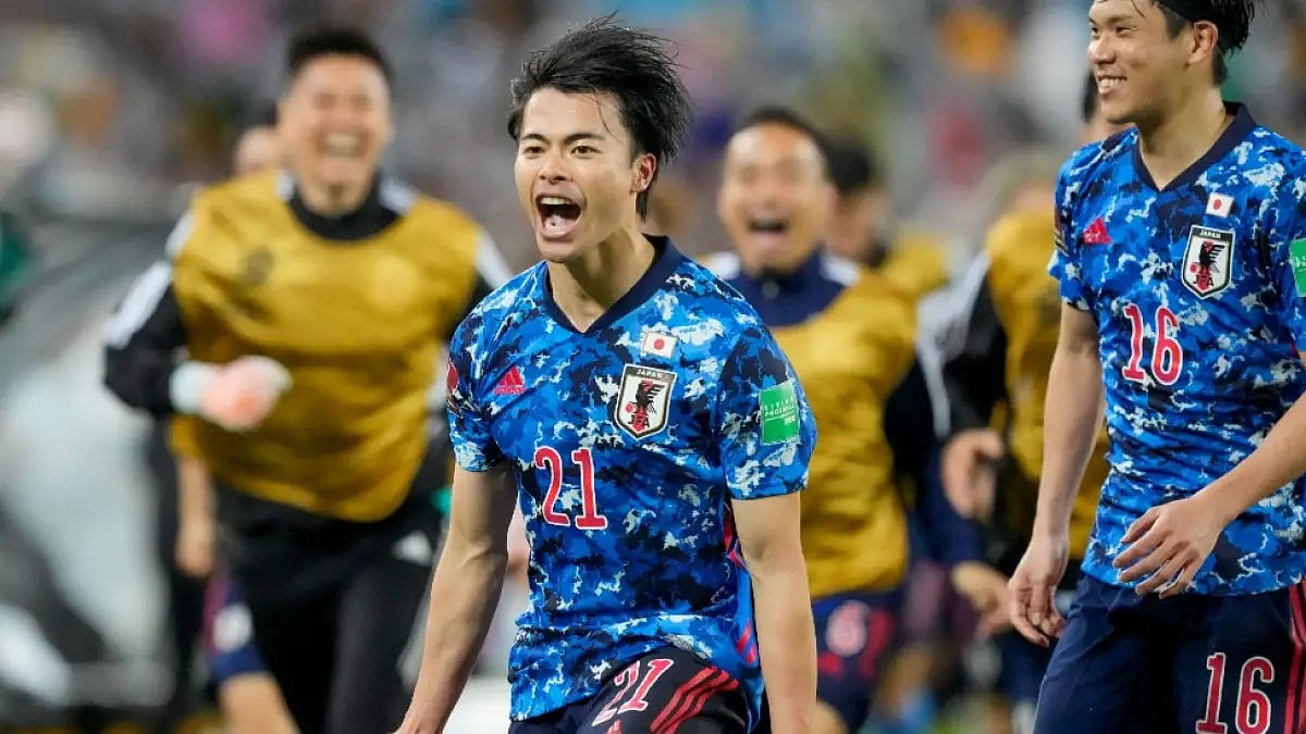 Japan's Kaoru Mitoma celebrates after scoring against Australia in the World Cup Asian qualifiers.