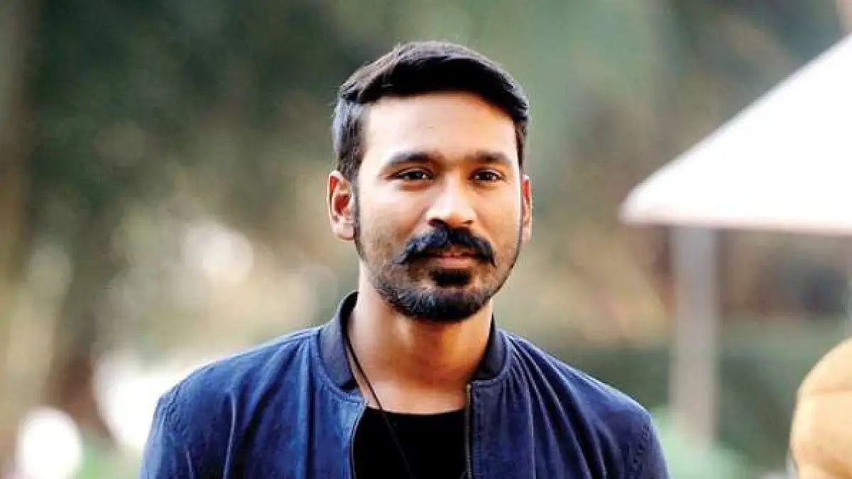 Makers release Dhanush's first look from 'Naane Varuven'.