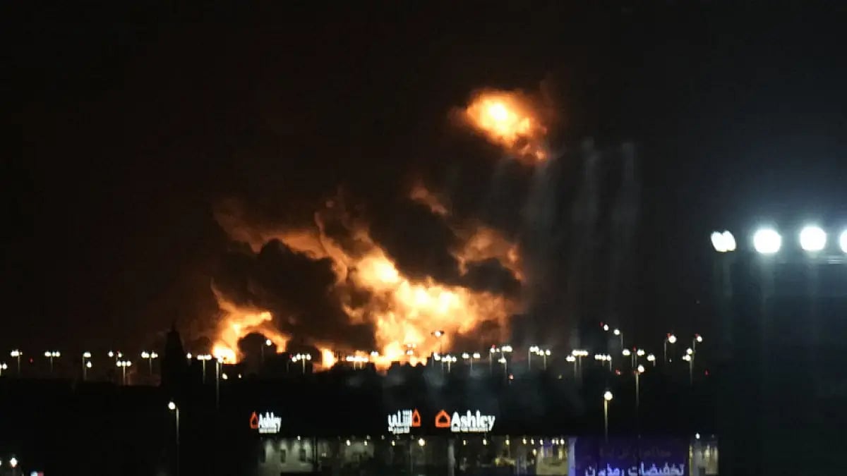 Fire form a oil depot lights the sky over Jiddah, Saudi Arabia, Friday, March 26, 2022.