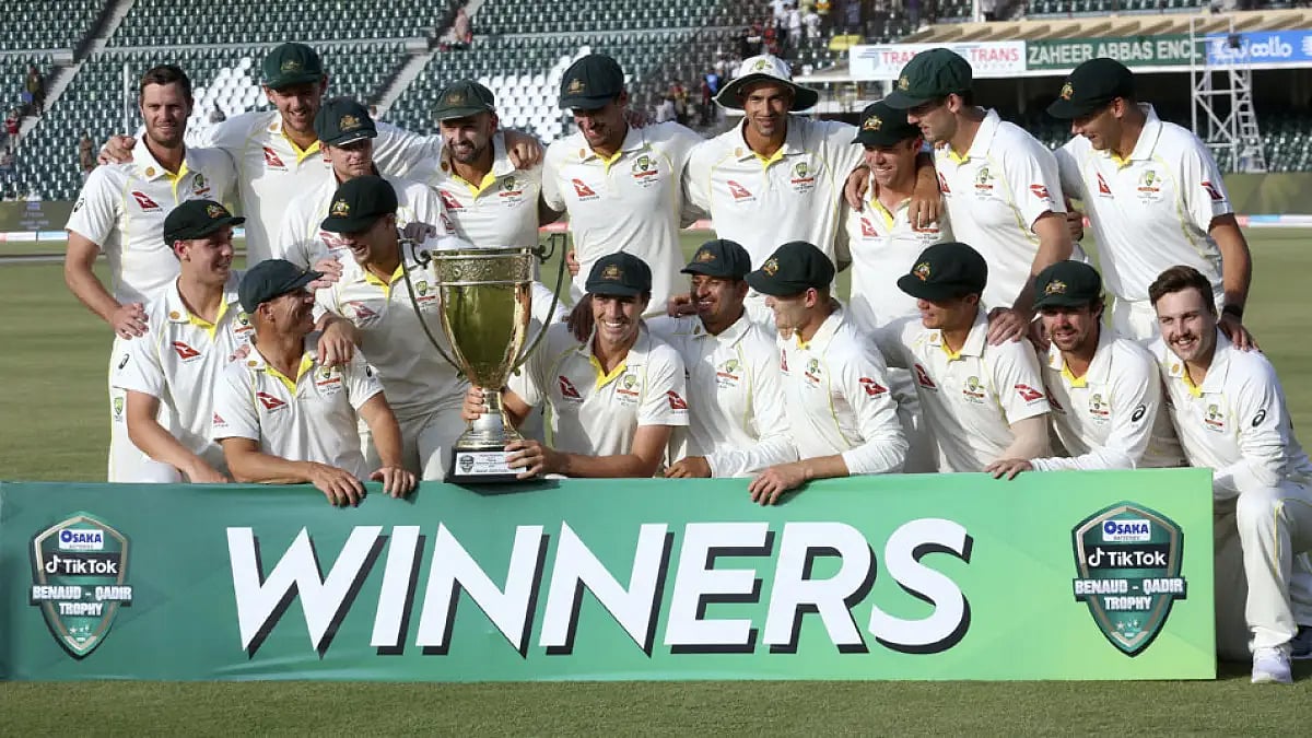 Australian players pose with the trophy after winning the third Test against Pakistan in Lahore.