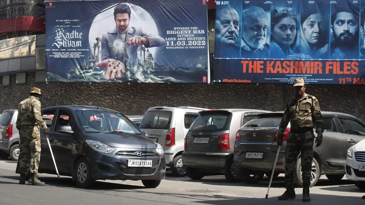 Security personnel stand guard outside KC-PVR at Bakshi Nagar in Jammu on March 17