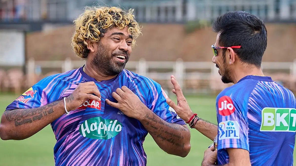 Rajasthan Royals fast bowling coach Lasith Malinga shares a light moment with Yuzvendra Chahal.