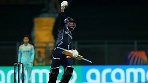 Gujarat Titans' Rahul Tewatia rejoices after hitting the winning runs against Lucknow Super Giants.