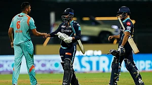 Rahul Tewatia shakes hands with Avesh Khan after Gujarat Titans beat Lucknow Super Giants.
