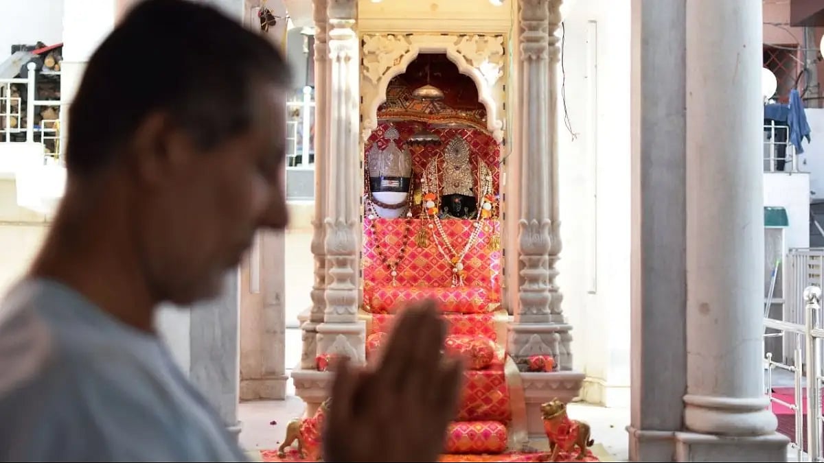 A devotee at Kheer Bhawani temple at Janipur in Jammu.