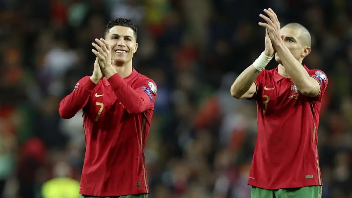 Portugal's Cristiano Ronaldo and Pepe (right) celebrate at the end of World Cup 2022 playoff match b