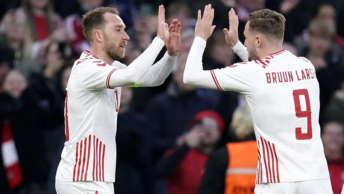 Denmark's Christian Eriksen (L) celebrates after scoring during International friendly vs Serbia.