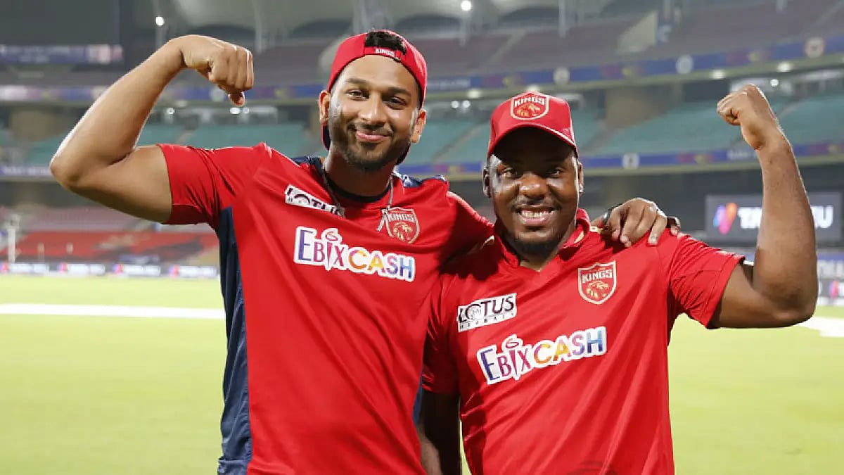 Punjab Kings' Shahrukh Khan and Odean Smith flexing muscles. Watch KKR vs PBKS, IPL 2022 match live.