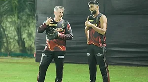 Pratham Singh (right) with KKR coach David Hussey.